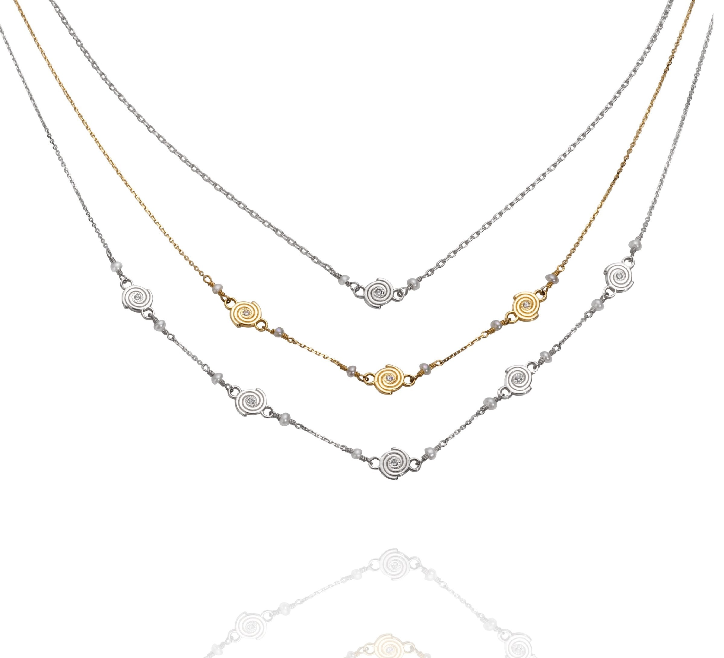 Single Spiral Necklace in Argentium Silver, Triple Spiral Necklace in 14k Yellow Gold, and Five Spiral Necklace in Argentium Silver 