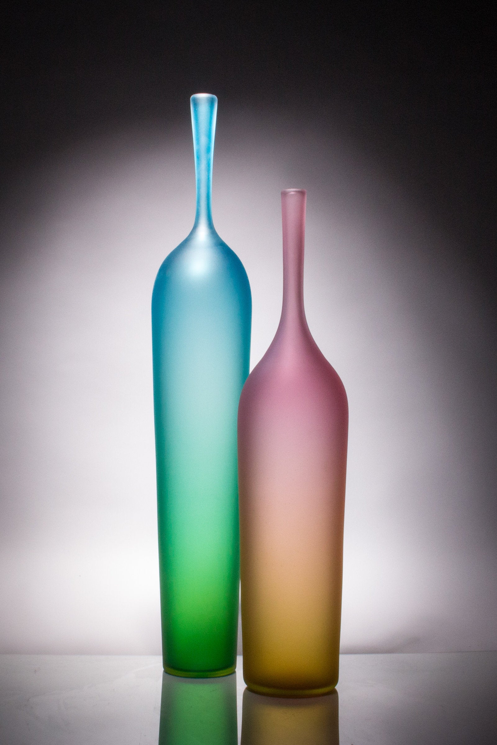 left to right: tall blue/green, medium pink/gold