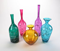 left to right: green, ruby, gold, purple, (blue no longer available)