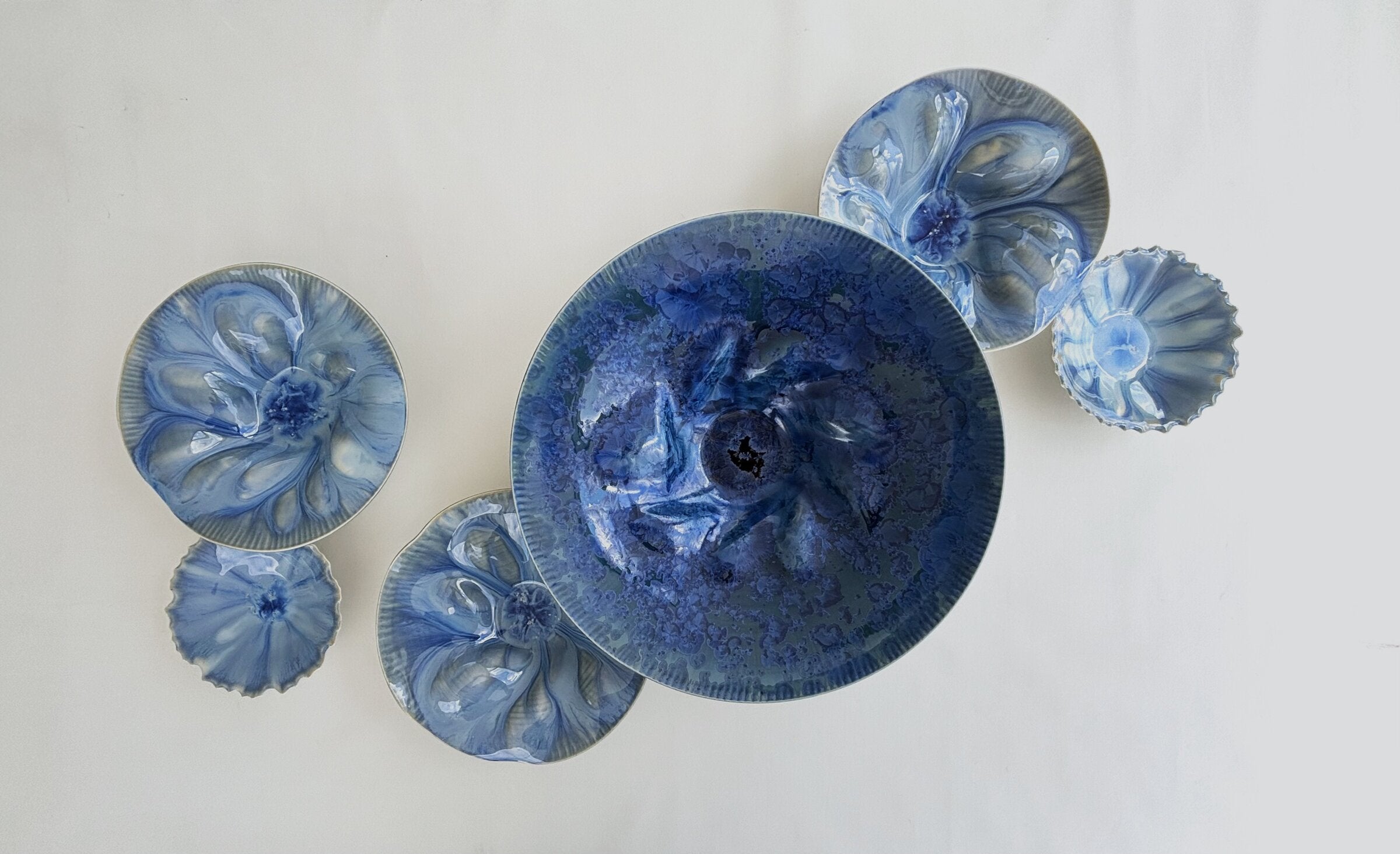 Porcelain Wall Installation with Deep Teal Crystalline