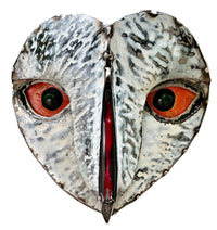 White owl with orange eyes