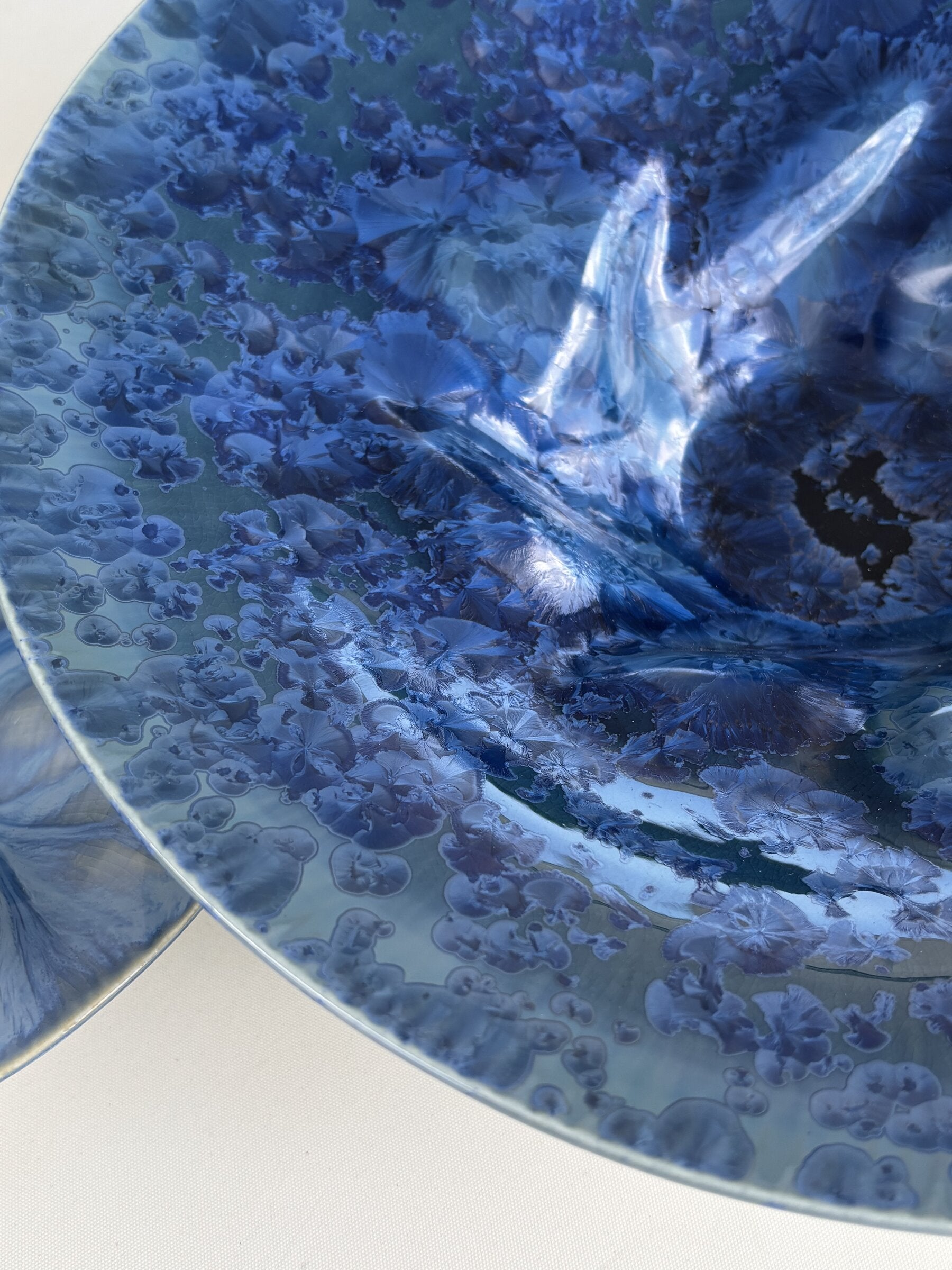 Porcelain Wall Installation with Deep Teal Crystalline