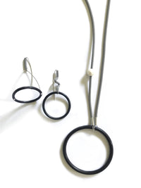 shown with big circle and a pearl necklace