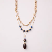 shown layered with the artist's Asawa Storm Agate Necklace and Smoky Quartz & Baroque Pearl Pendulum Pendant