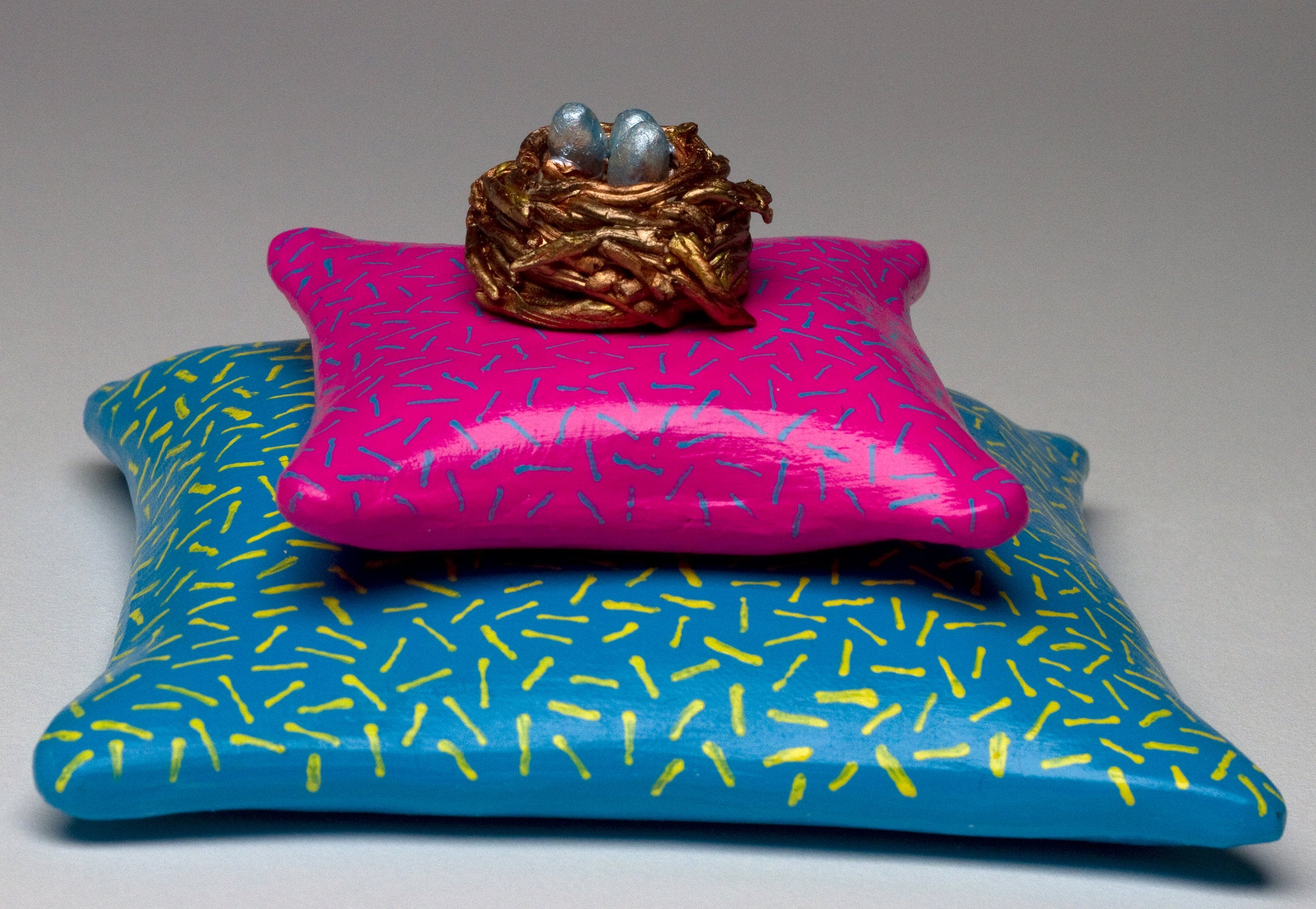 Nest on Pink Pillow