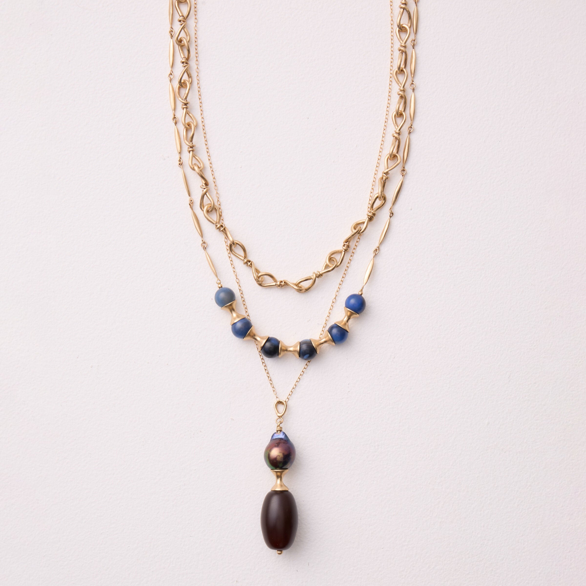 shown layered with the artist's Knot Link Chain Necklace and Asawa Storm Agate Necklace