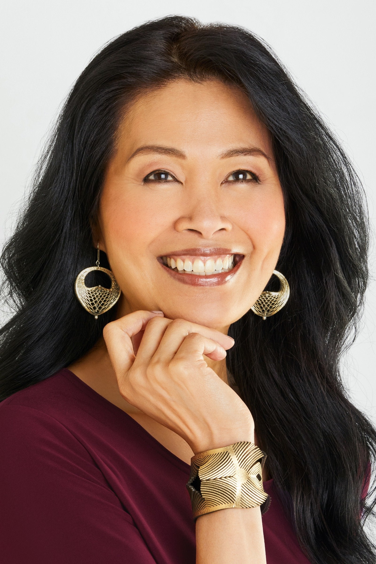 shown with the artist's Plumeria Bracelet