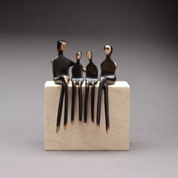 Family of Four Conversation Mounted on Limestone