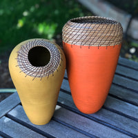 left to right: Ochre Nest, Oval Vessel in Orange