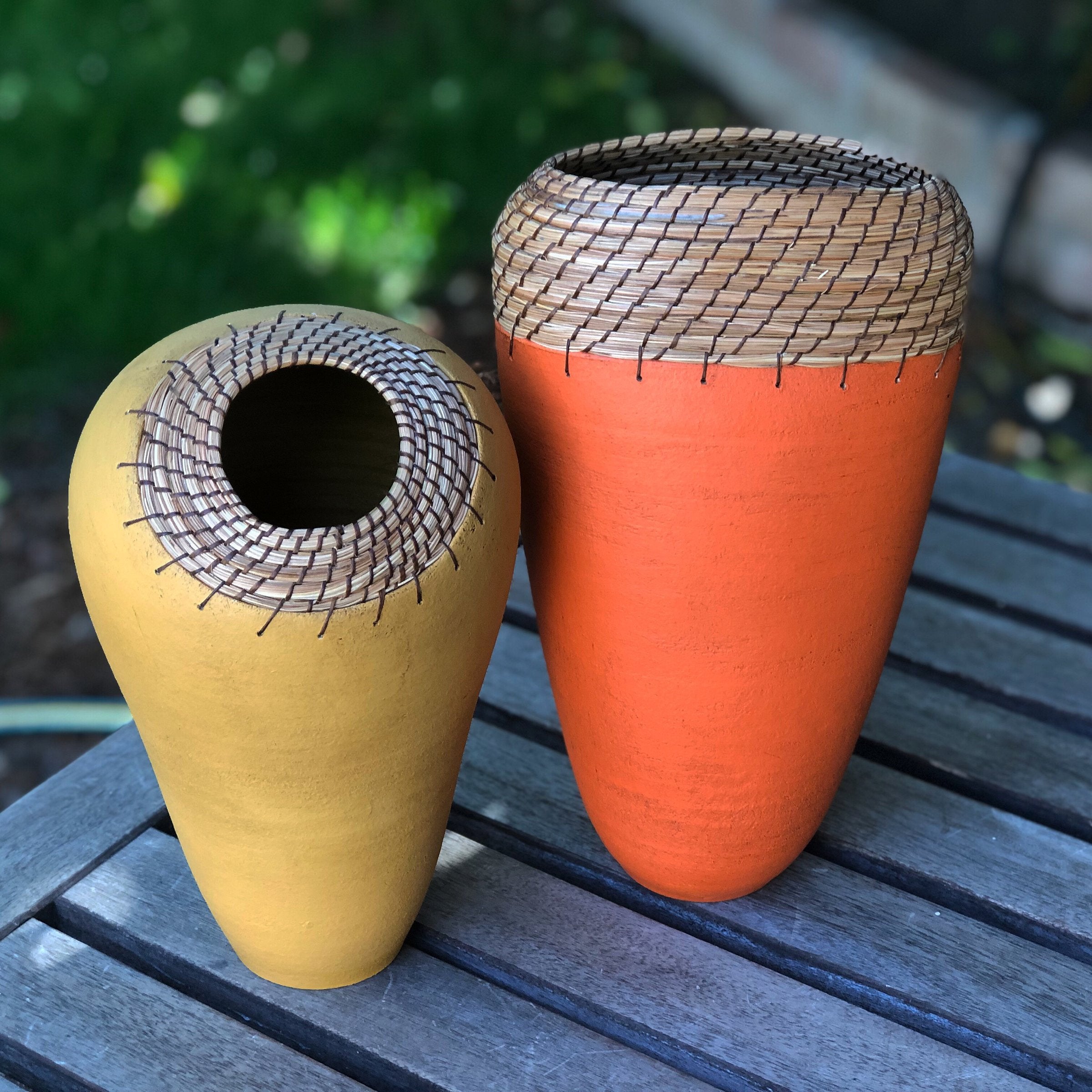 left to right: Ochre Nest, Oval Vessel in Orange