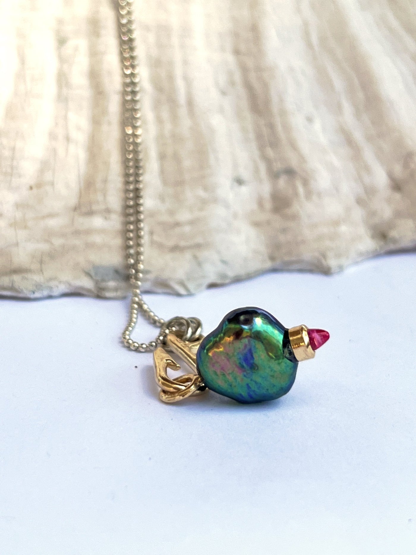 Fish Hook Catches the Peacock Pearl Charm Necklace