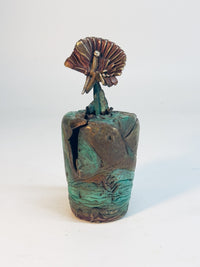 Red Flower in Green and Red Vase