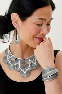 silver metallic leather, shown with area 51 earrings & squash blossom necklace
