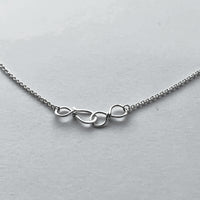 Infinity hook clasp