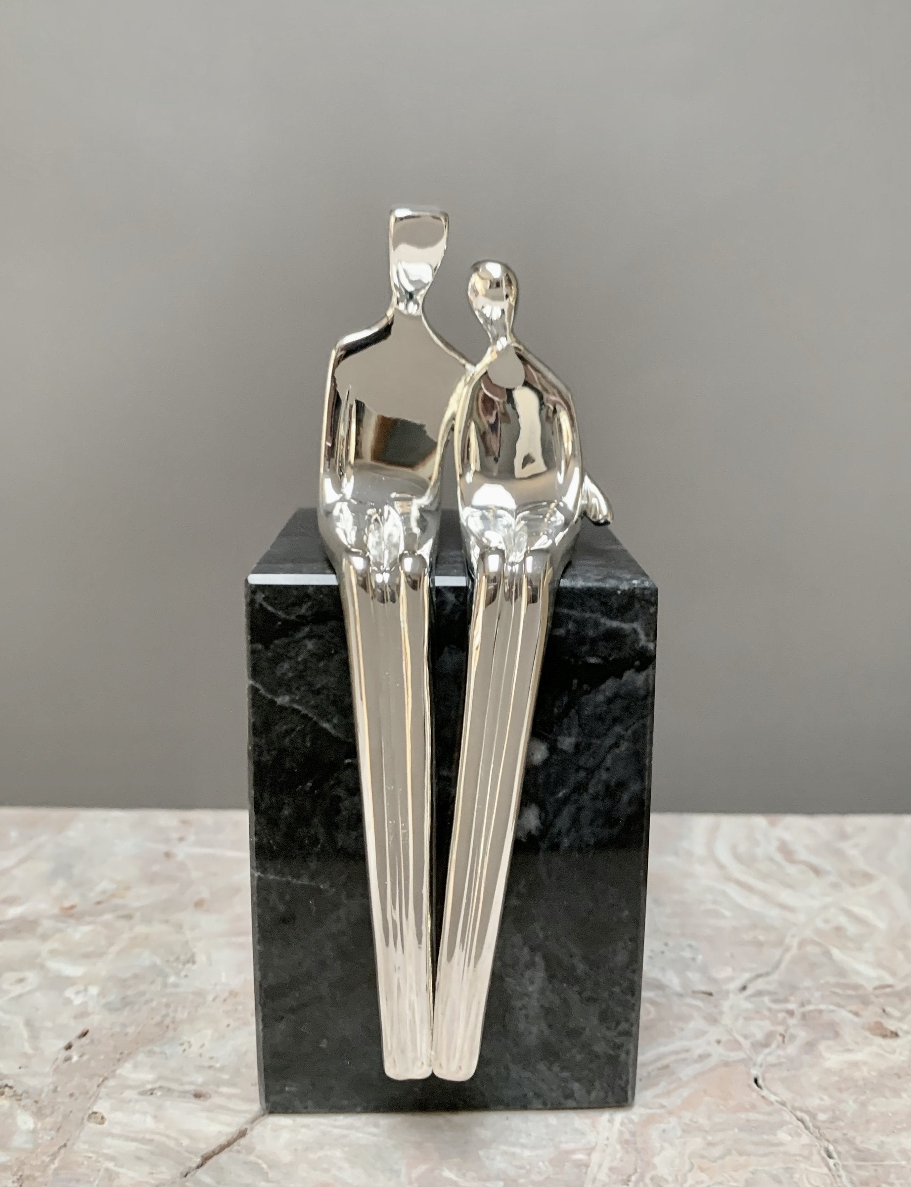 silver with black marble base