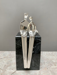 silver with black marble base
