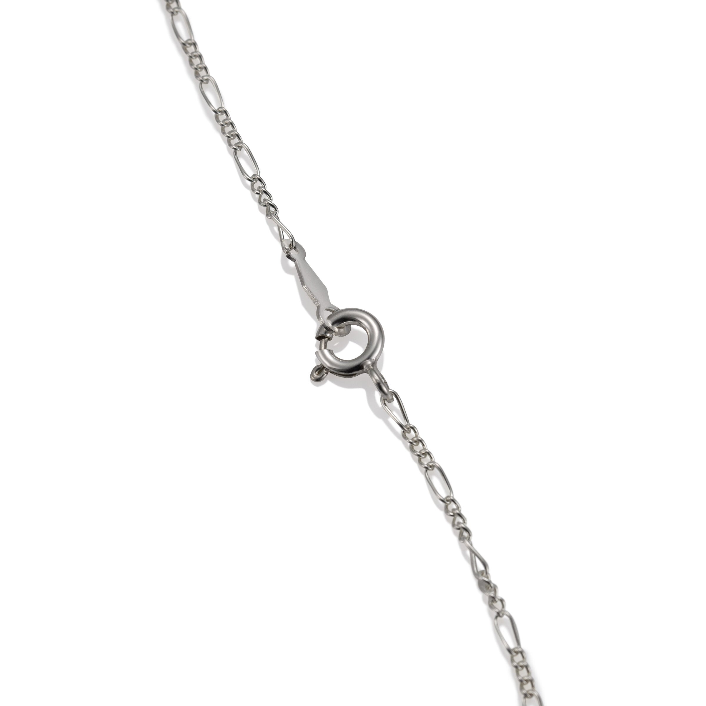 Tiny Gemstone Pendant clasp | Photo by Berlian Arts