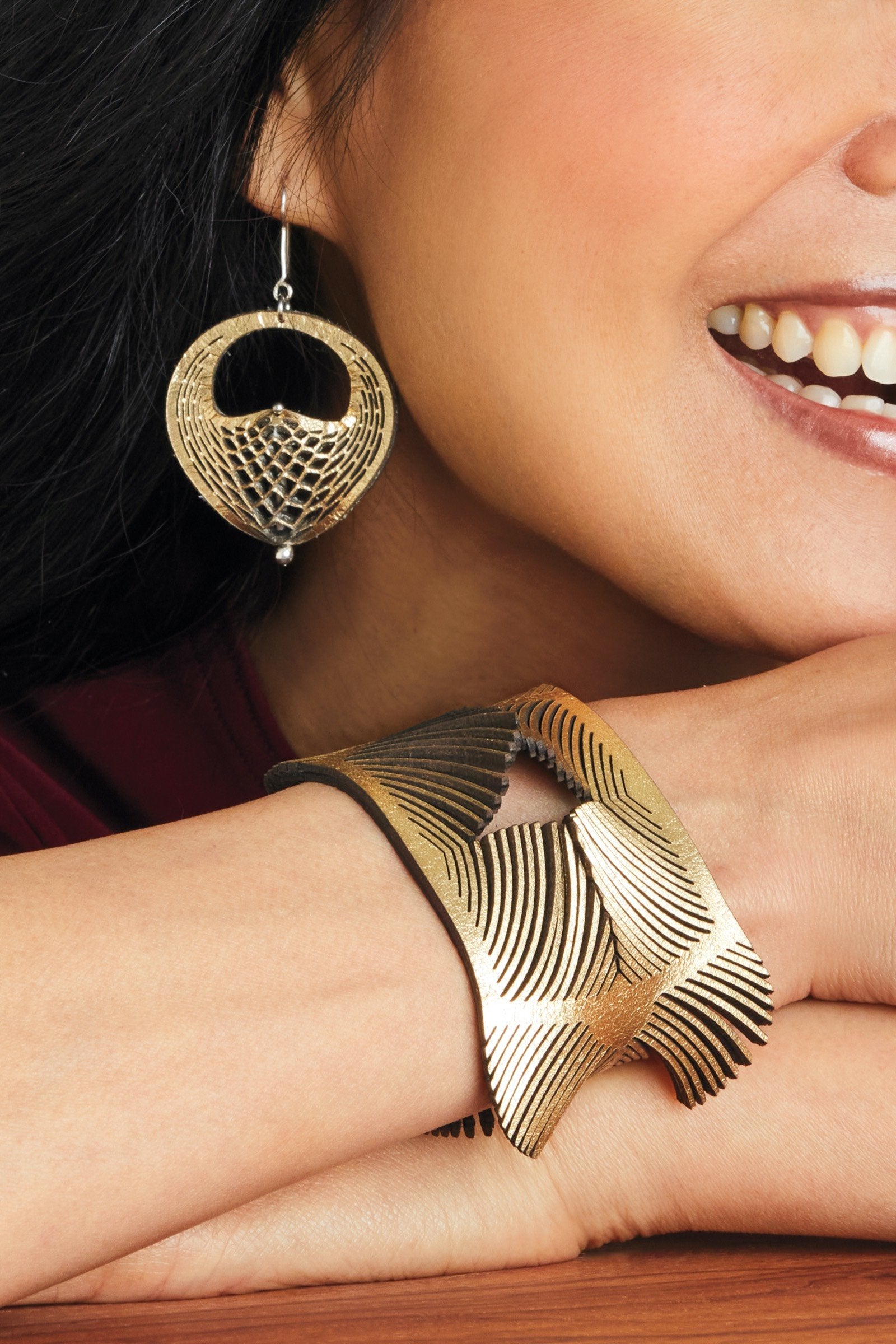 shown with the artist's Plumeria Bracelet