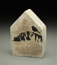 House with Bird in Silhouette