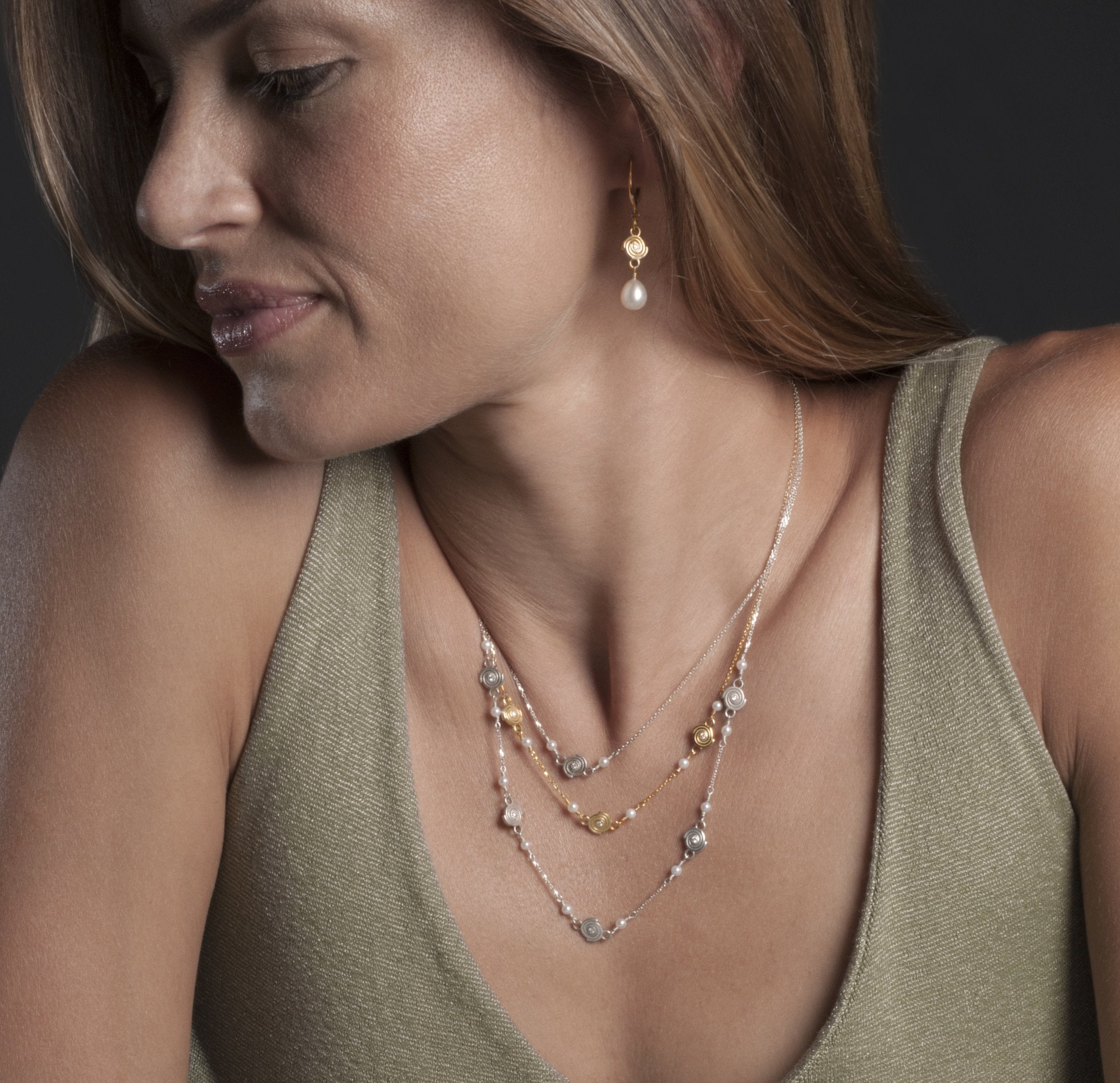Single Spiral Necklace in Argentium Silver, Triple Spiral Necklace in 14k Yellow Gold, and Five Spiral Necklace in Argentium Silver 