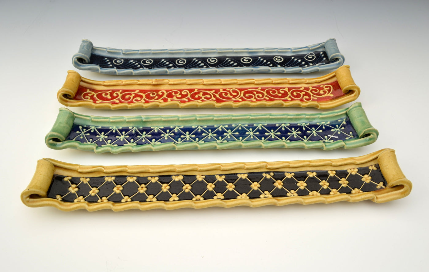 top to bottom: blue with black accent, honey with red accent, green with blue accent, honey with black accent