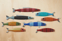 top to bottom, left to right: Large in Red Stripes, Small in Aqua Dots, Large in Black White Dots, Small in Orange Dots, Small in Green Gold Dots, Medium in Blue Stripes, Small in Red Pinstripe