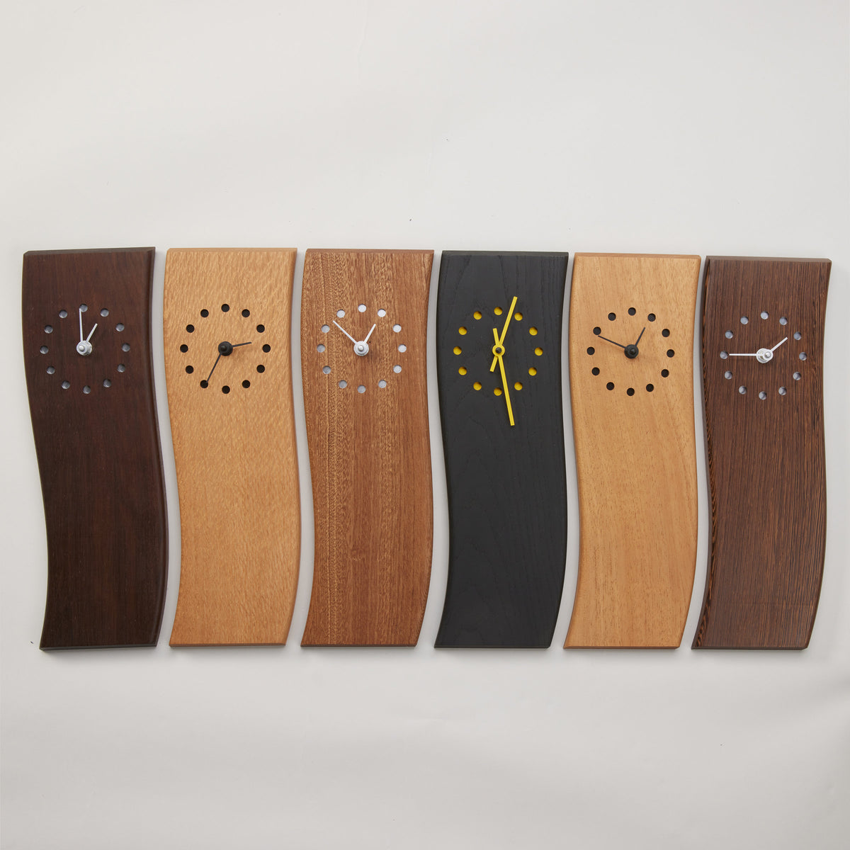 left to right: Peruvian walnut with silver handslacewood with black handssapele with silver handsblack-dyed ash with yellow handsSpanish cedar with black handswenge with silver hands | Photo by Steve Smith Photography