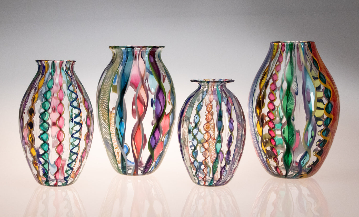 left to right: Small Cane Vase with Slight Flare, Large Cane Vase with Slight Flare, Small Cane Vase with Wide Flare, Large Cane Vase with Narrow Mouth