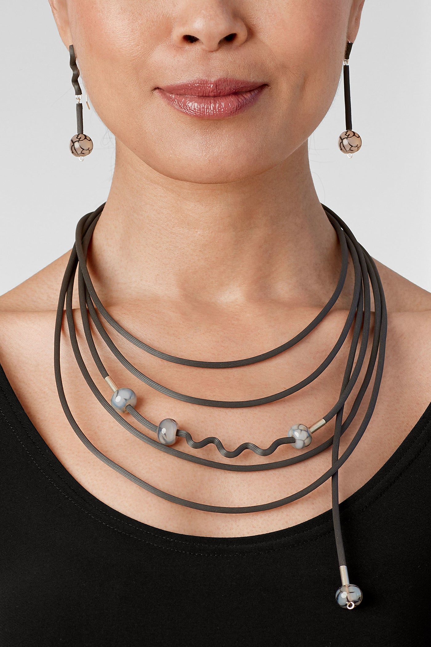 shown with the shades of gray necklace