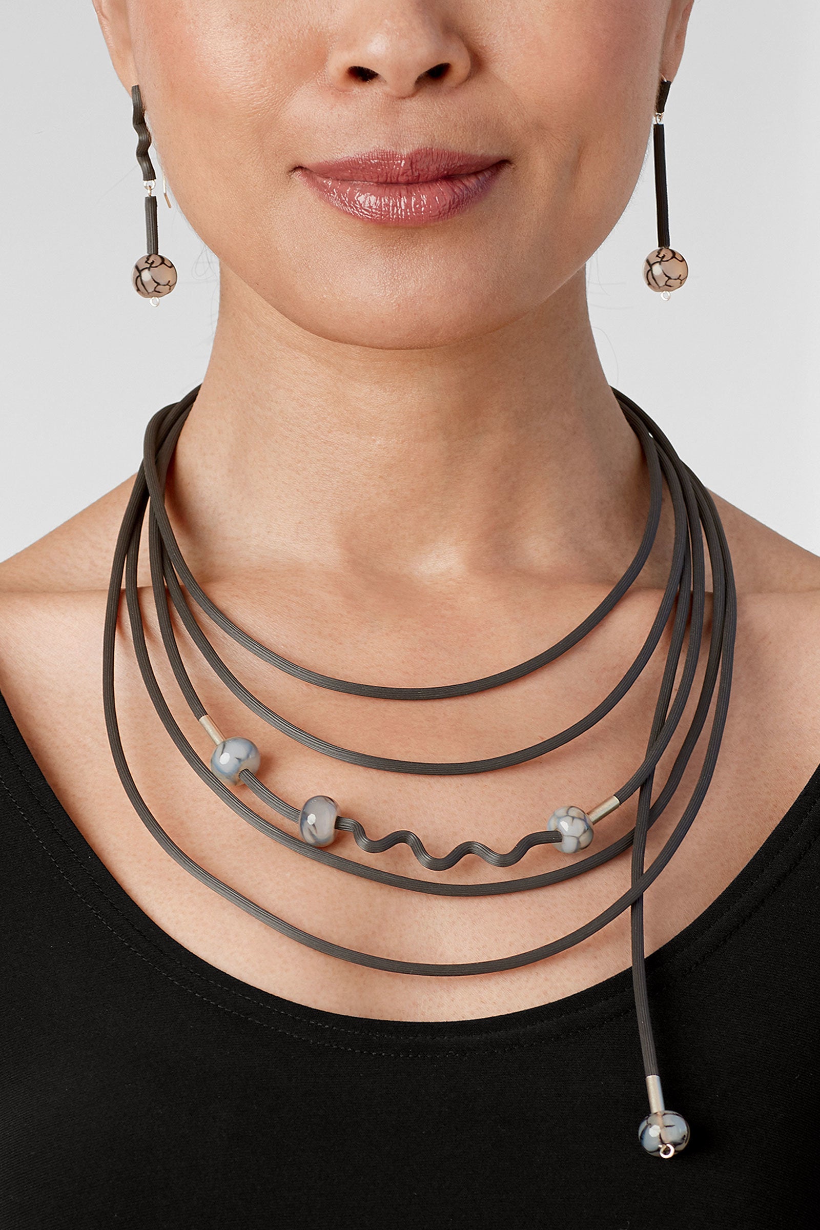 shown with the shades of gray necklace