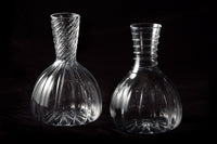 Twisted Optic Rib Decanter (left). Spiral Wrap Decanter (right).