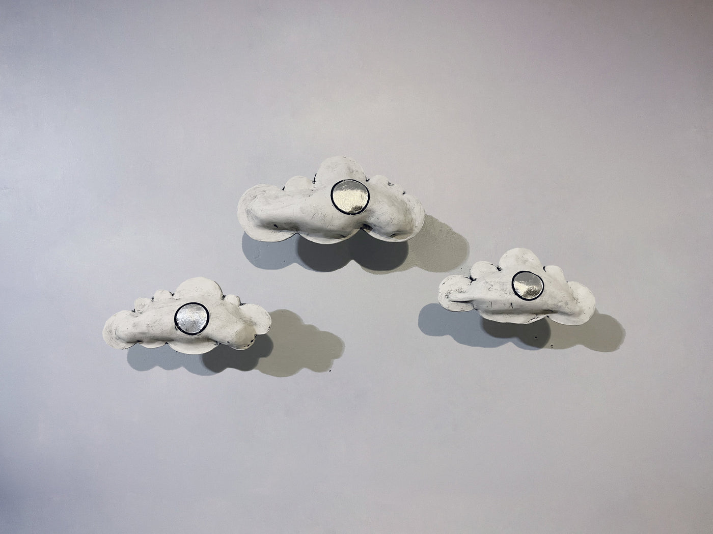set of three clouds