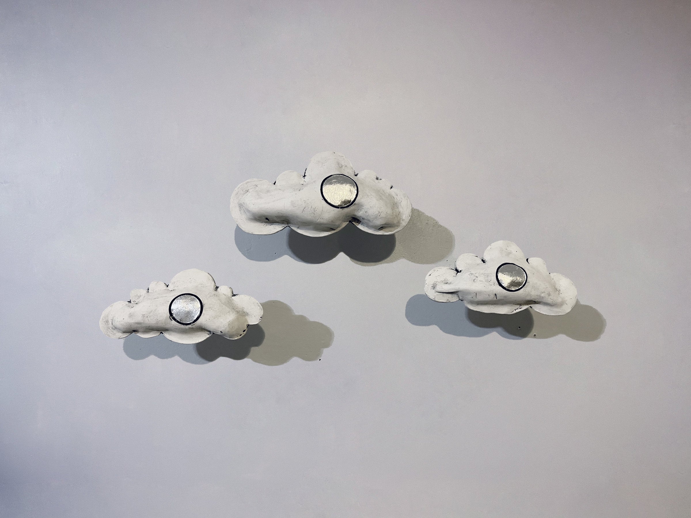 set of three clouds