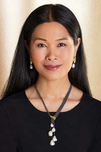 shown with the artist's harmony earrings