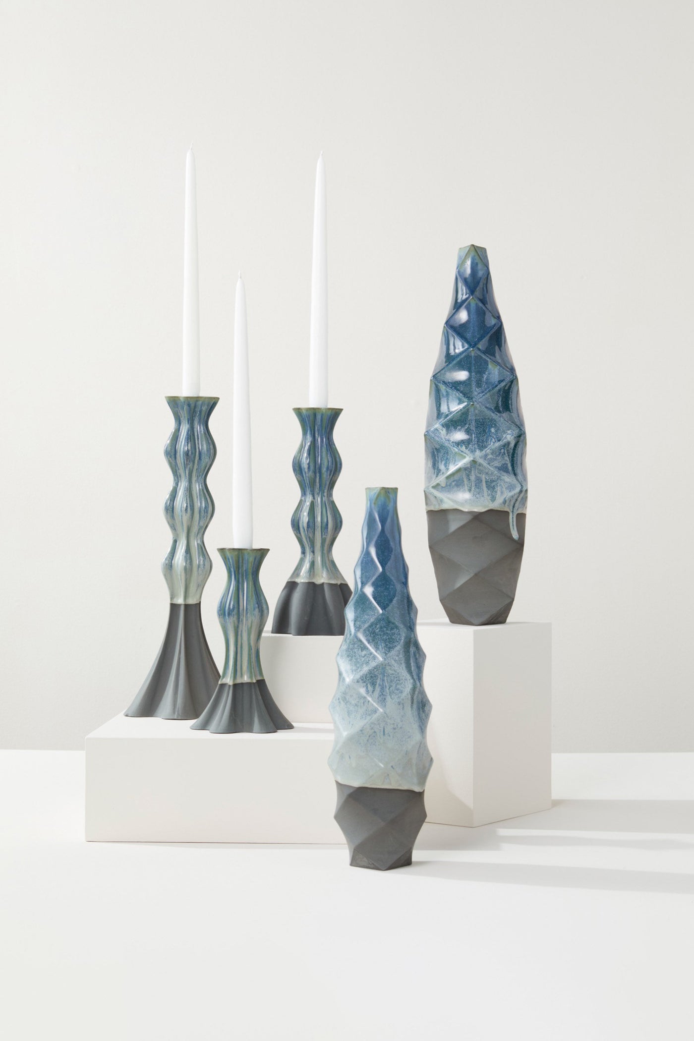 Curved Candlesticks & Faceted Ceramic Vessels