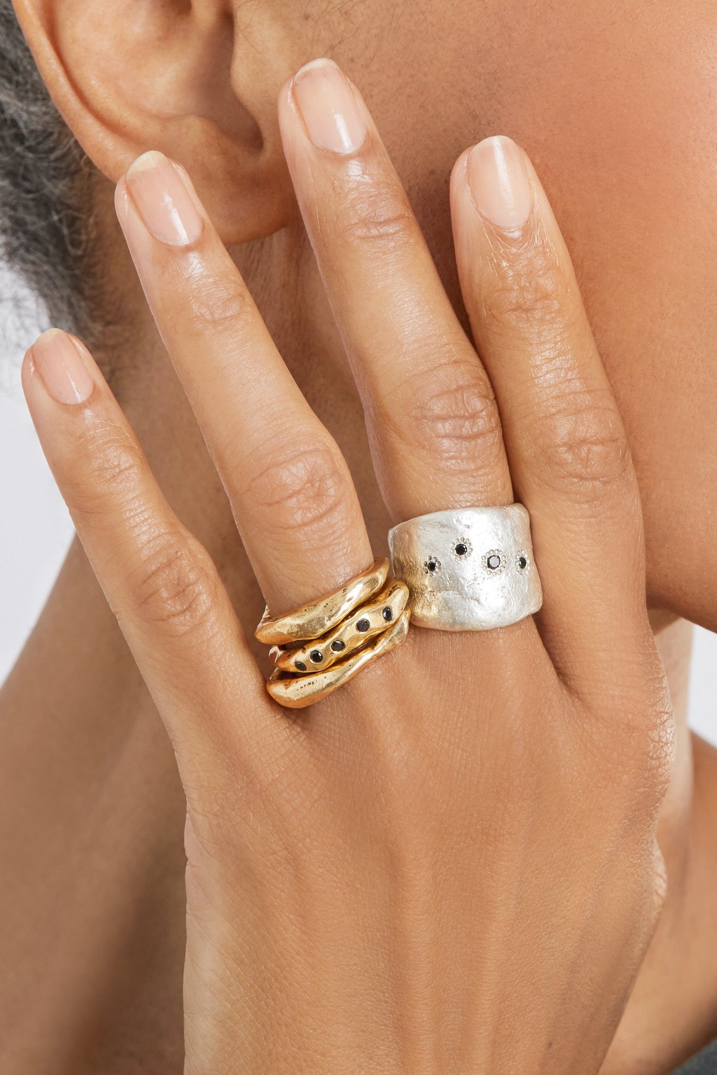 shown with the artist's Bronze Stacking Rings with Black Diamonds