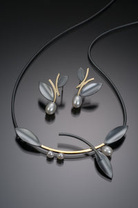 Oxidized Silver and Gold, shown with the artist's coordinating alternating leaf earring with pearl