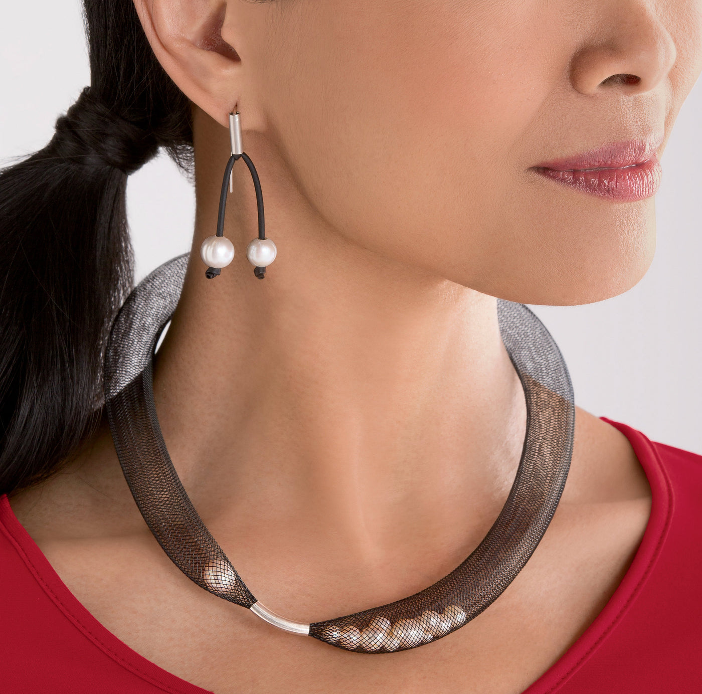 shown with the pearls in net necklace