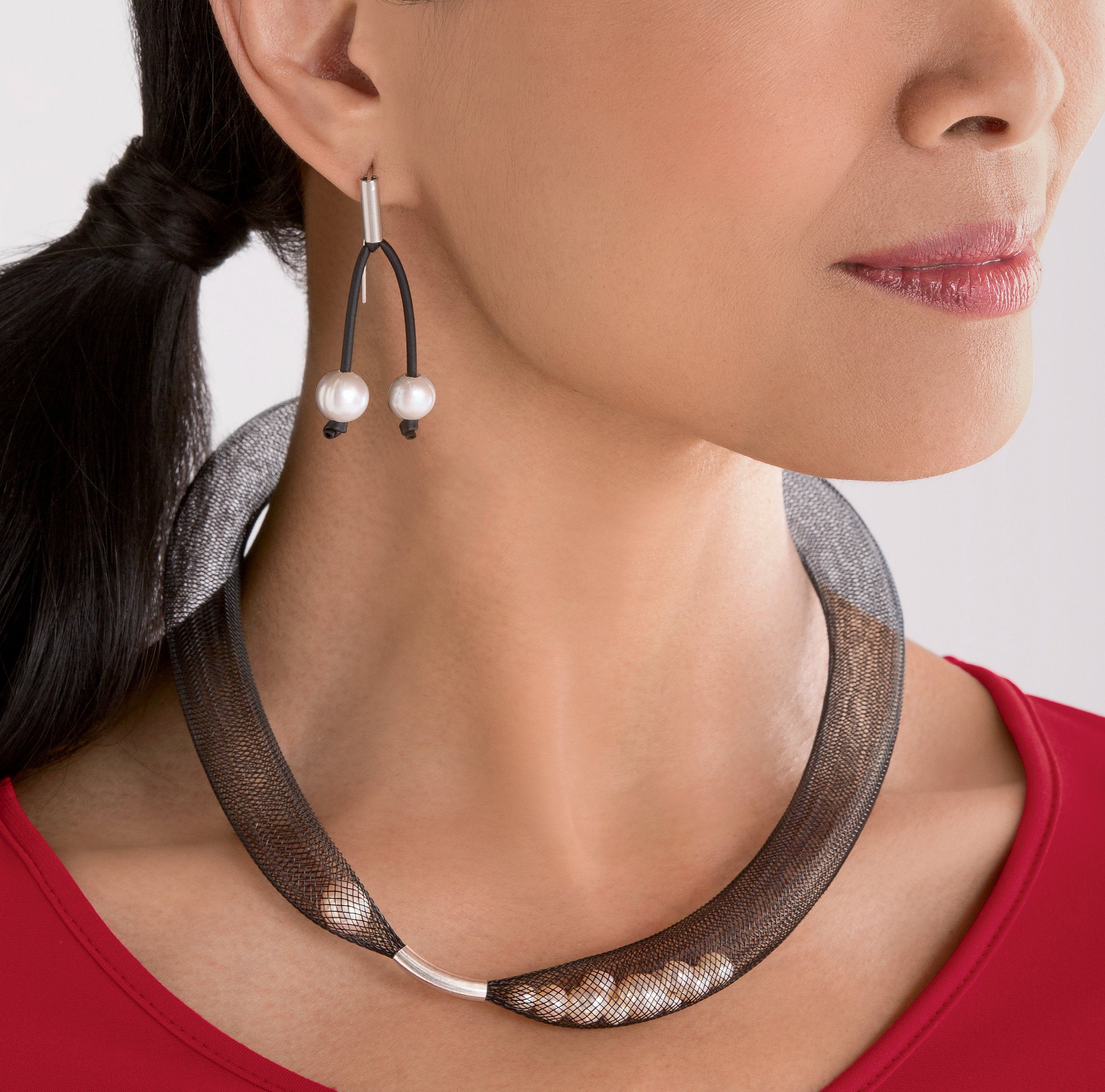 shown with the pearls in net necklace