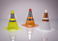 left to right: mini yellow, mini orange, and mini white traffic cone