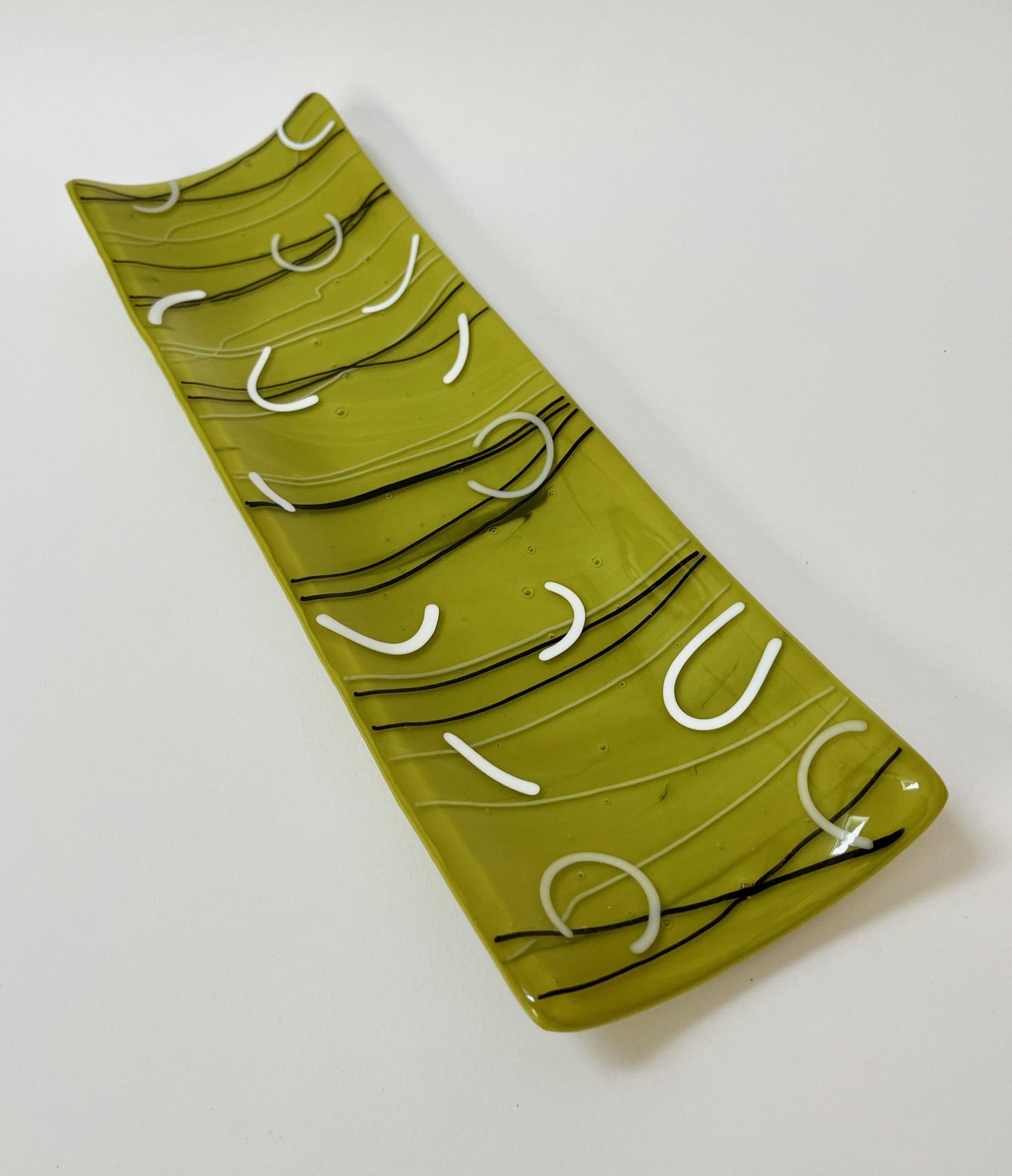 White Arcs on Green Platter