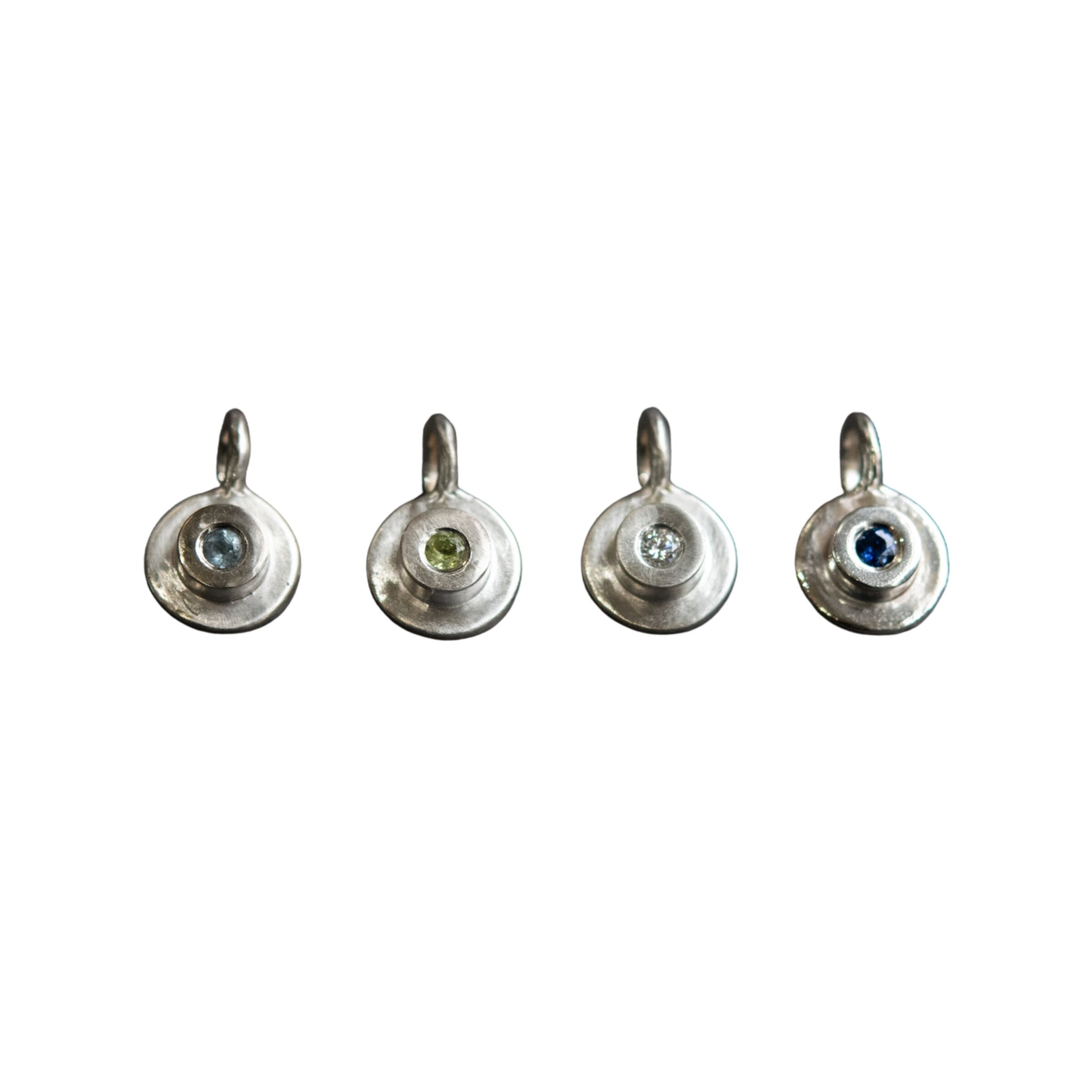 Left to Right: Aquamarine, Peridot, Diamond, Blue Sapphire
