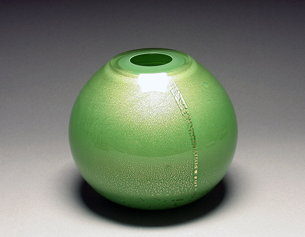 gold vase in green