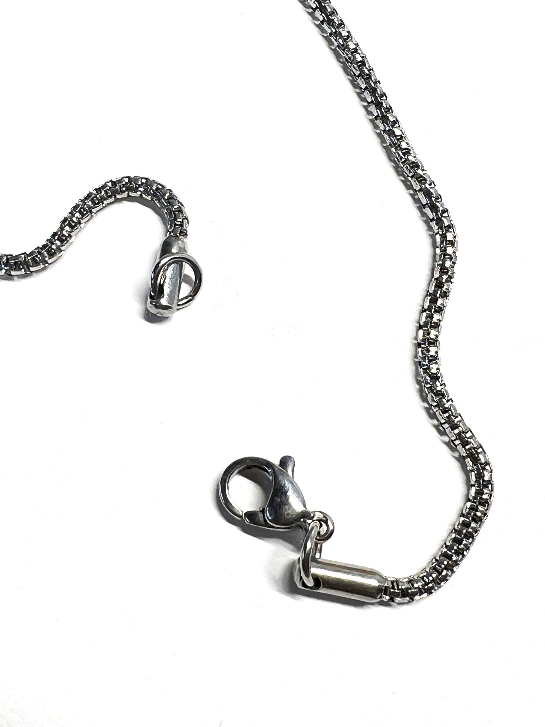 Stainless steel chain with lobster claw clasp | Photo by Artist