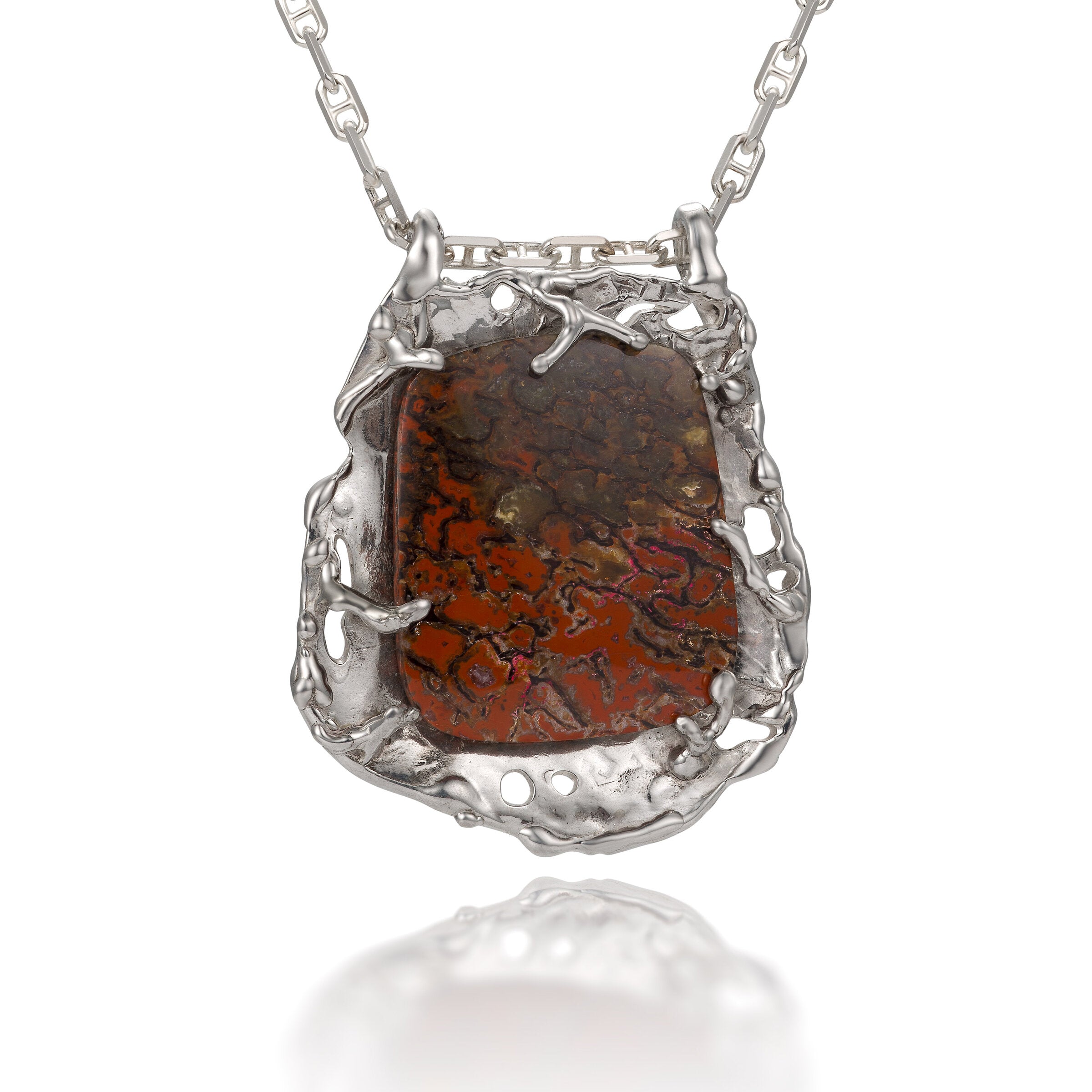 Petrified Dinosaur Bone Pendant | Photo by Berlian Arts