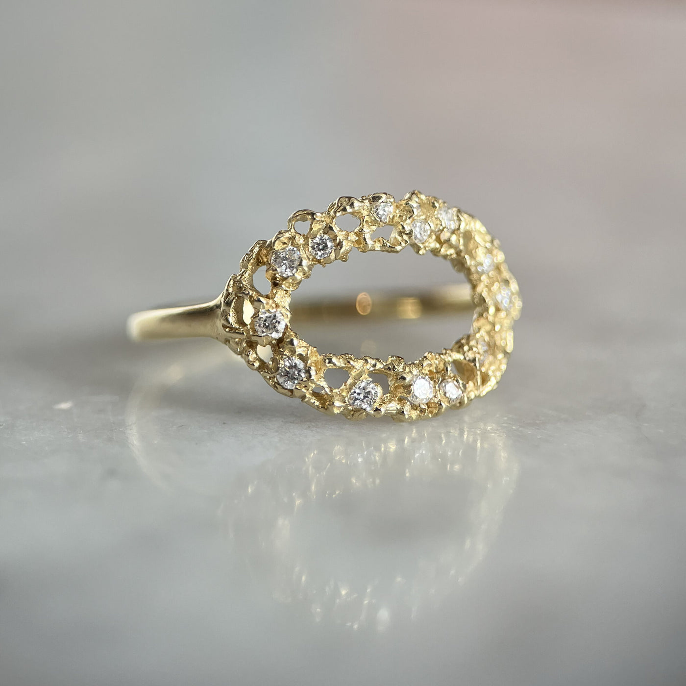 delicate oval ring with diamonds