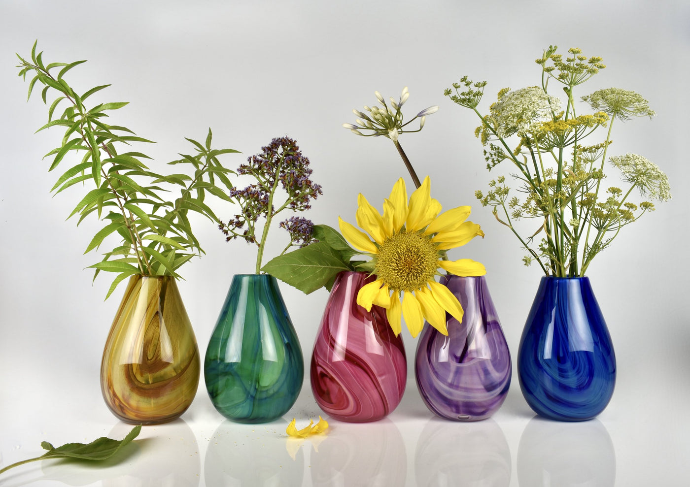left to right: gold, green, pink, purple, blue
