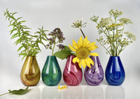 left to right: gold, green, pink, purple, blue