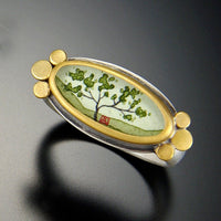 shown with gold bezel