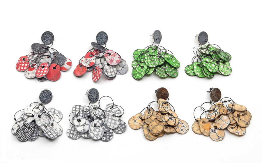 Left to Right: Red & Black, Green & Black, Black & White, Copper & Gray